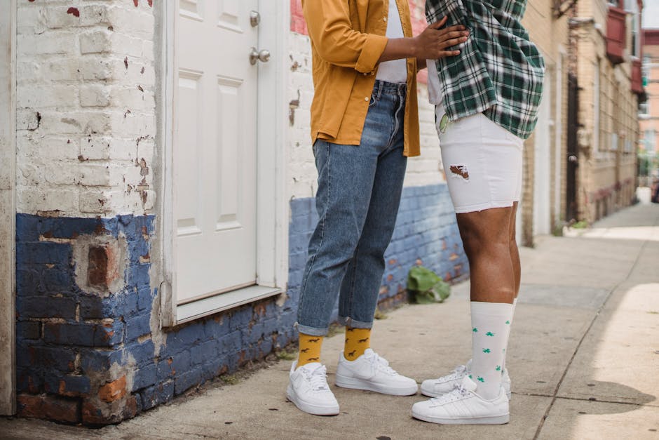 Two Men Standing in the Street and Embracing